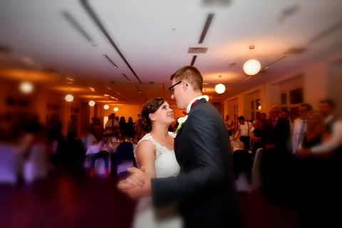 Young bridal couple dancing waltz