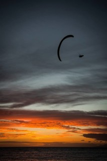 Paraglider at Playa de la Enramada at sunset in Adeje