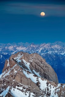 Santis Mountain overlooking Alpstein massif at full moon