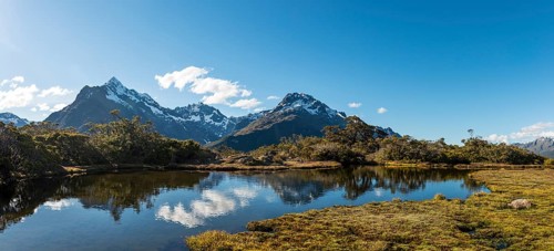 Small mountain lake with reflection