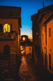 Narrow illuminated alleyway in the old town