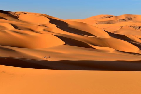 Group of people in the Sanddunes of Moul Naga
