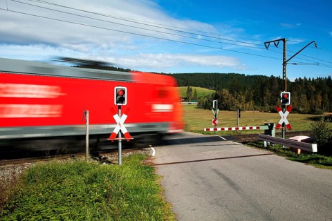 Level crossing with passing train