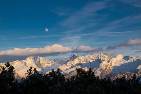Snowy Zillertal Alps with moon in winter