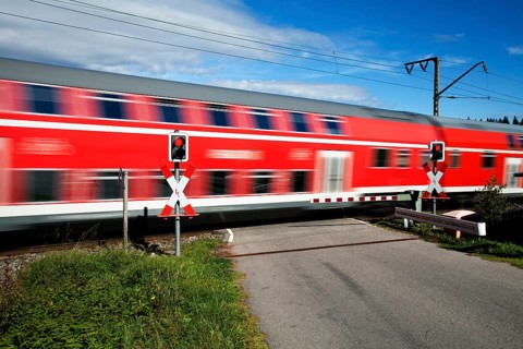 Level crossing with passing train