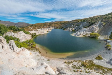 Lake surrounded by limestone cliffs