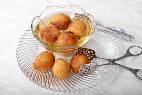 Swabian dessert on glass plate with pastry tongs