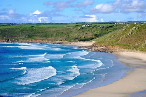 Wide sandy beach with waves