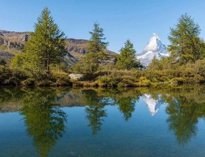 Snow-covered Matterhorn reflected in the lake