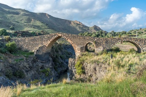 Medieval Saracens bridge crossing the river Simeto
