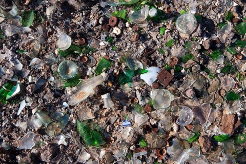 Broken glass and scrap metal at a dump