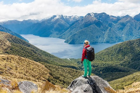 Female hiker looking at the South Fiord of Lake Te Anau