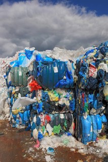 Plastic film in bales for recycling in a recycling plant