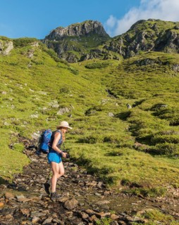 Hiker crossing a stream bed