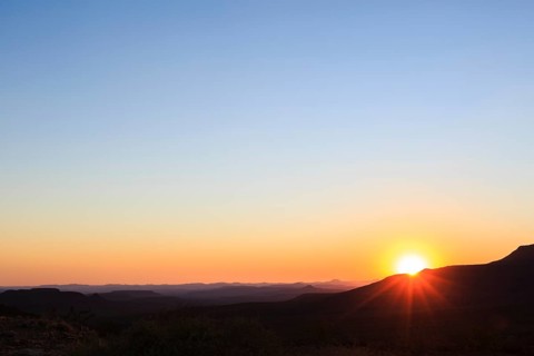 Staggered mountains at sunset