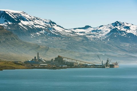 Aluminium hut in front of snowy mountains