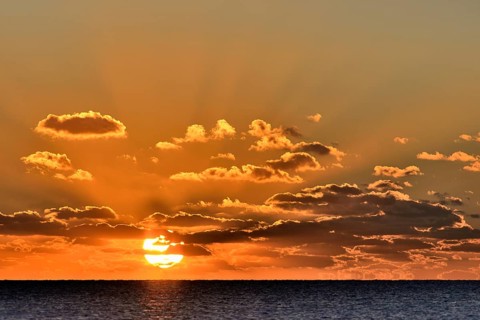 Sunset with cloudy sky above the North Sea