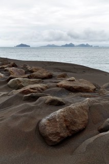 Rock on dune of lava sand