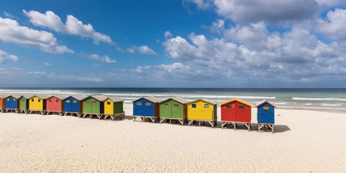 Colorful beach houses with cloudy sky