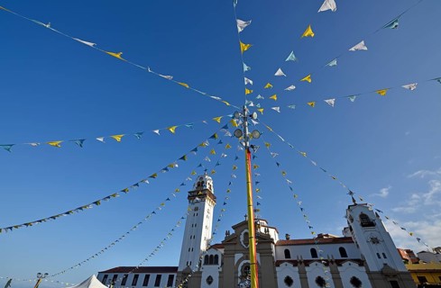 Colorful pennants at a festival in front of the Basilica de Nuestra Senora