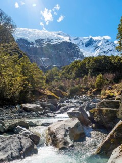 Glacial river flowing through mountains