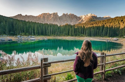 Woman overlooks Lake Carezza