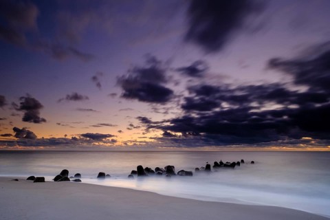 Concrete blocks as coastal protection on the beach of Hornum in the evening light