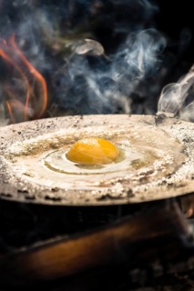 Fried egg fried over campfire