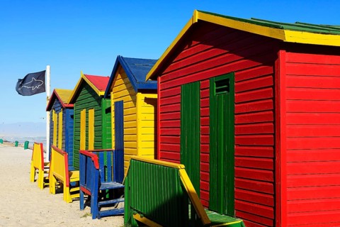 Colorful beach cottage with shark flag