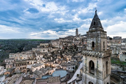 Church tower of San Pietro Barisano in front of the old town with cathedral