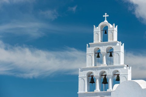 Bell tower in front of cloudy sky