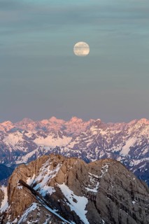 Santis Mountain overlooking Alpstein massif at full moon