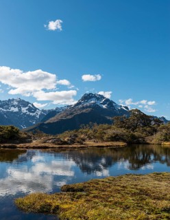 Small mountain lake with reflection