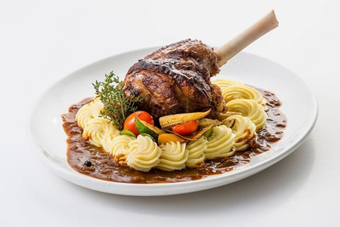 Roasted lamb shank on mashed potatoes