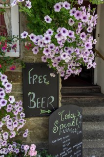 Sign Free Beer with small print