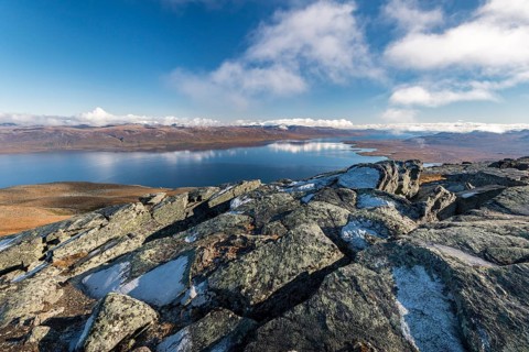 View from the top of the mountain Nuolja to the lake Tornetrask and the autumnal Fjell
