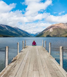 Woman sitting on dock