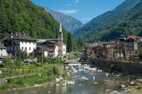 Historical Roman bridge over the Lys mountain river