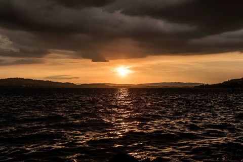 Sunset with clouds and stormy mood