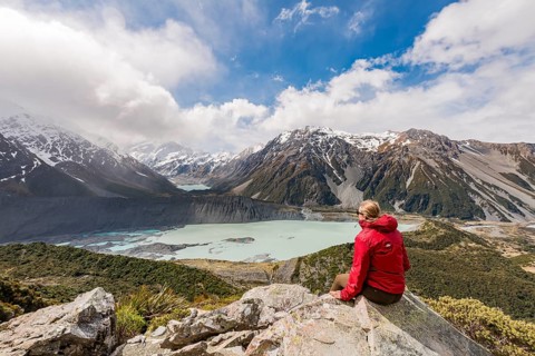 Hiker sitting on rocks