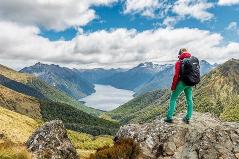 Female hiker looking at the South Fiord of Lake Te Anau