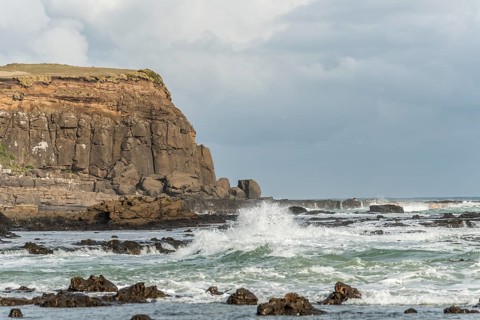 Cliffs and foaming waves