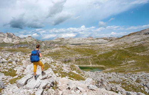 Hikers on the circular trail around the Sella Group near Lake Lech de Crespeina