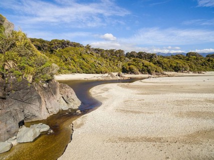 Beach with marshy river