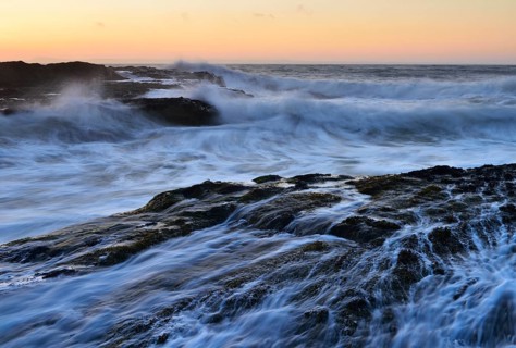 Waves breaking on rocks on the coast