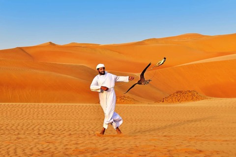 Falconer in the desert luxury hotel Anantara Qasr Al Sarab