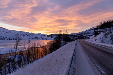 Dawn over half frozen lake