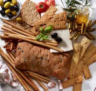 Various Italian baked goods with decoration of olive branches