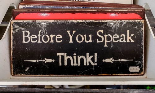 English quote on a metal sign