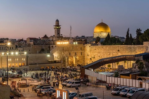 Believers at the Wailing Wall at dusk